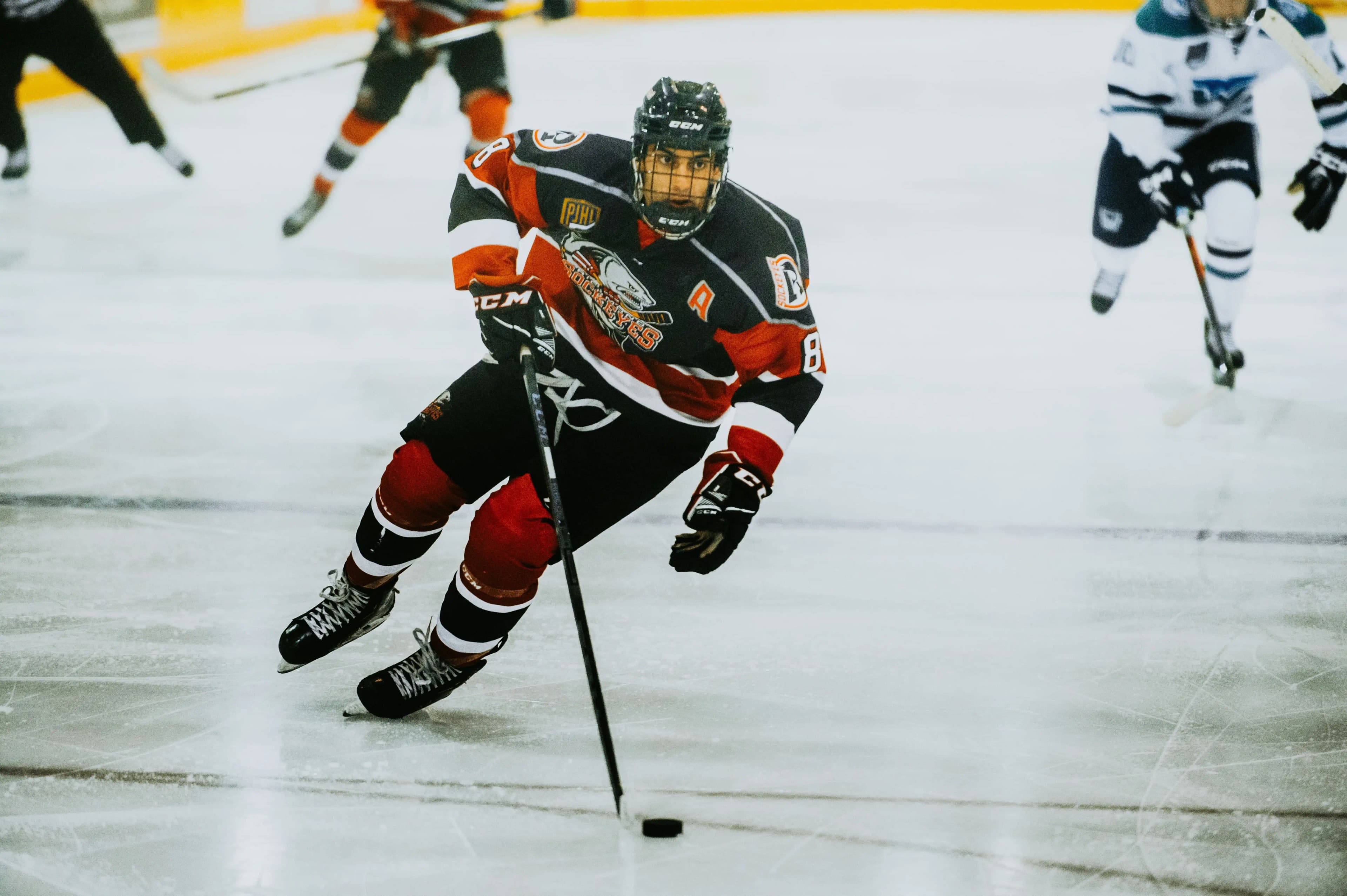 Ice hockey player skating with the puck